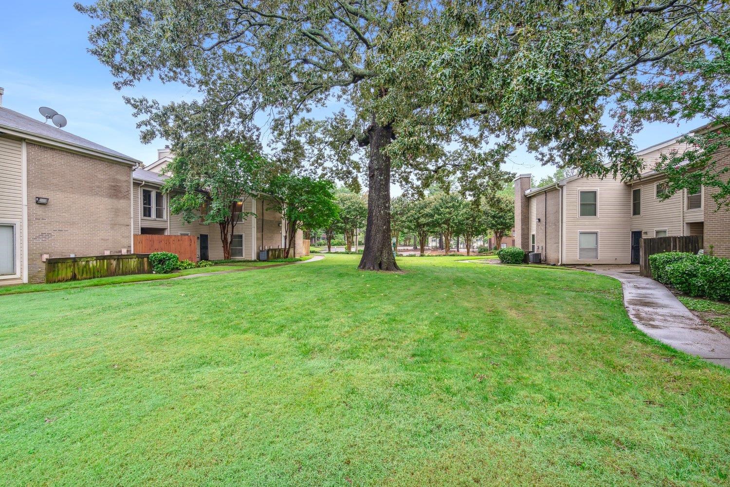 1701 Ridge Oak Place, Unit 4 Memphis, TN 38120 - Photo 20 of 21 a view of house with backyard