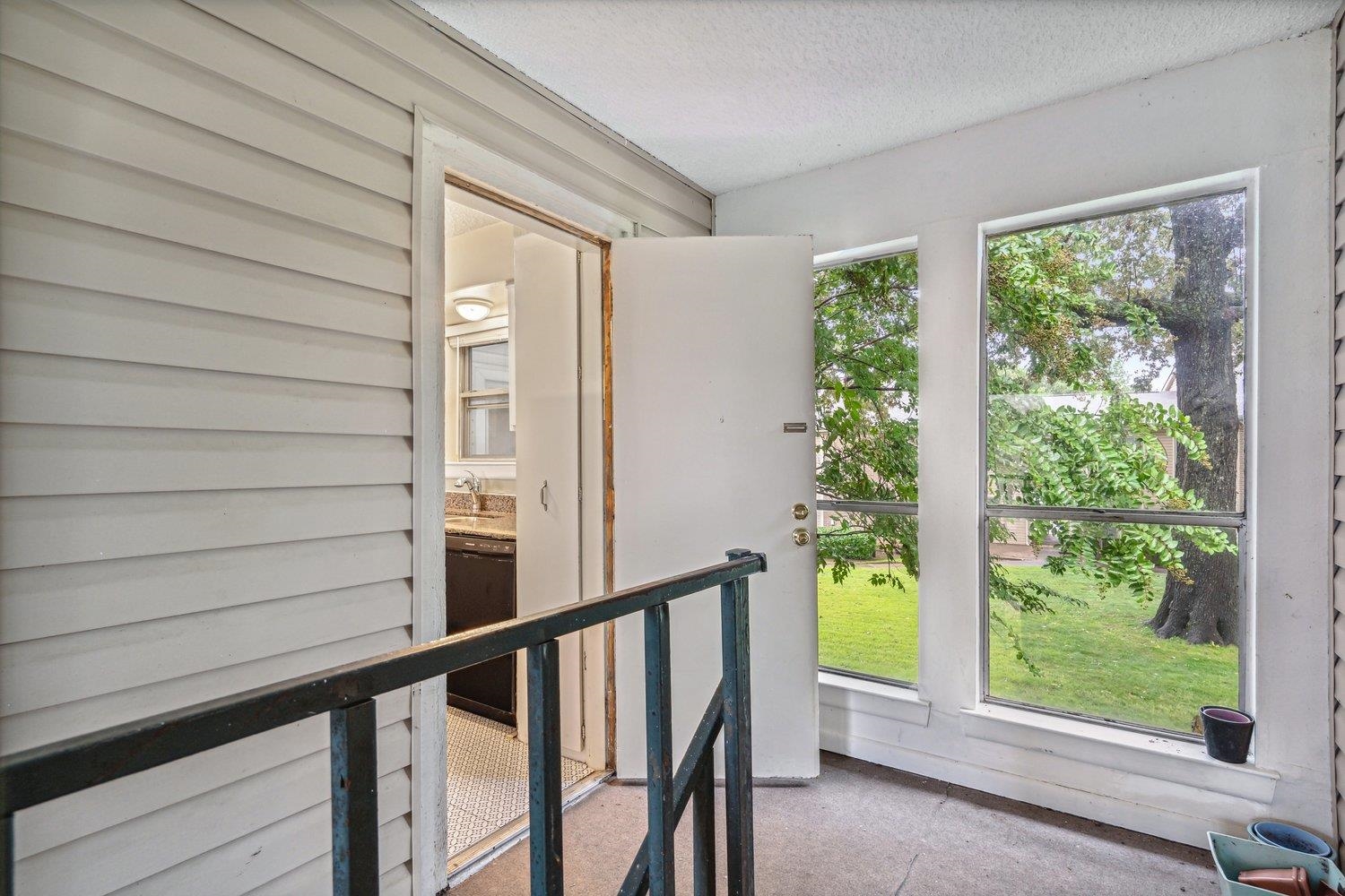 1701 Ridge Oak Place, Unit 4 Memphis, TN 38120 - Photo 2 of 21 a view of a balcony with an outdoor space