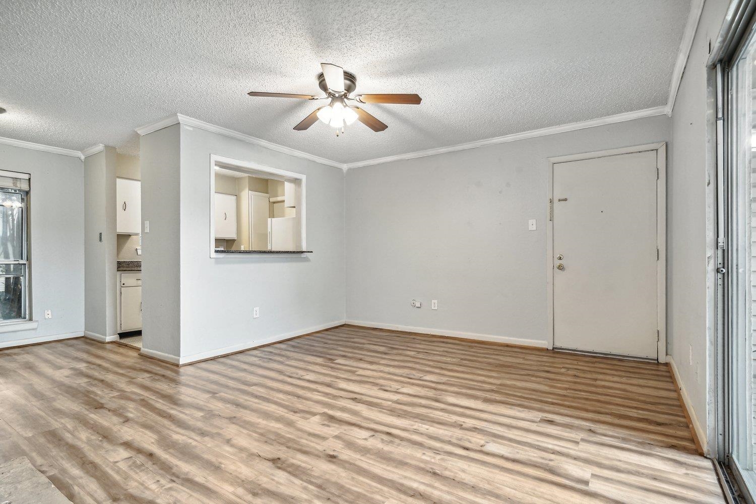 1701 Ridge Oak Place, Unit 4 Memphis, TN 38120 - Photo 9 of 21 a view of a livingroom with wooden floor and closet area