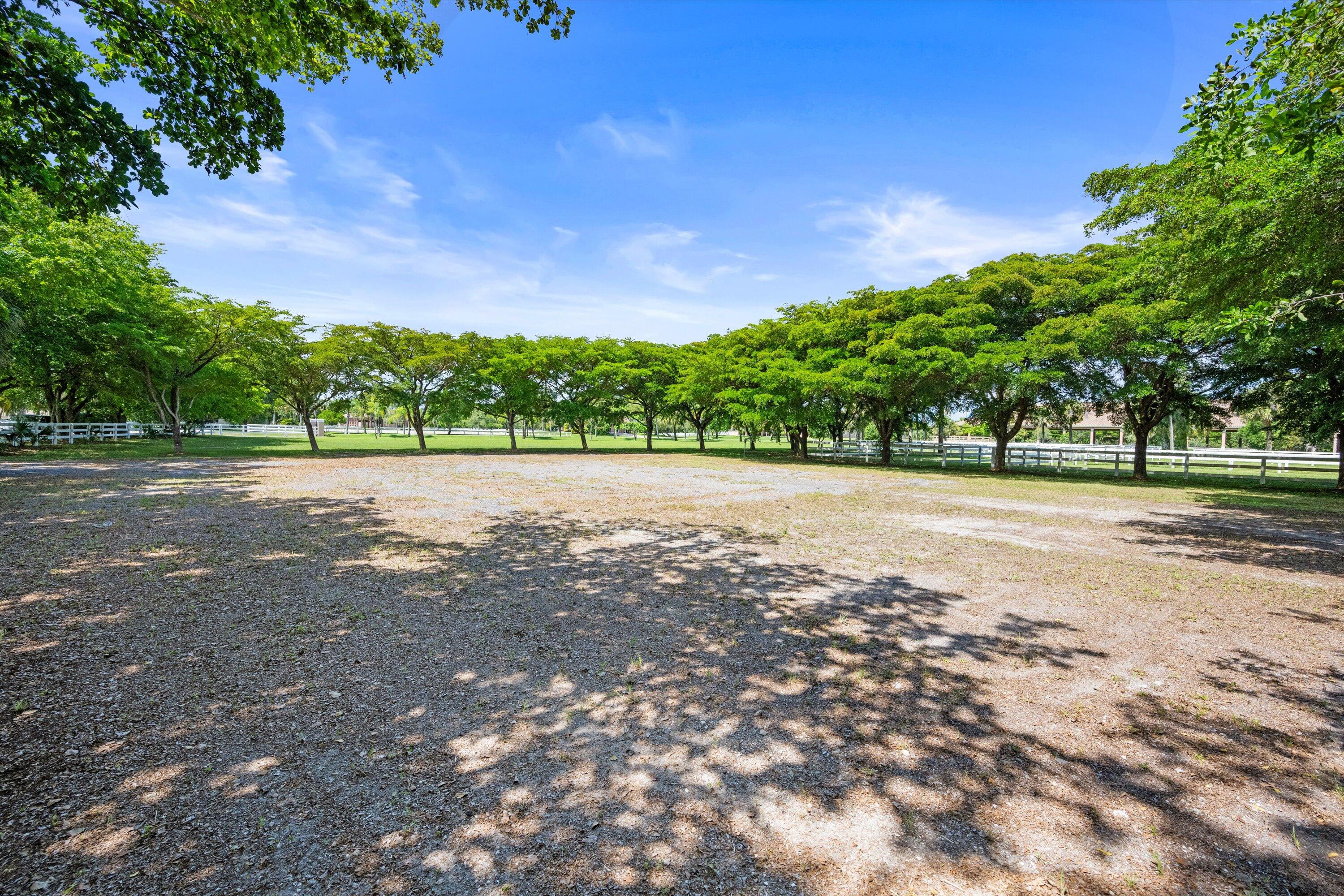 3287 Grande Road Loxahatchee, FL 33470 - Photo 117 of 126 a view of a road with a yard
