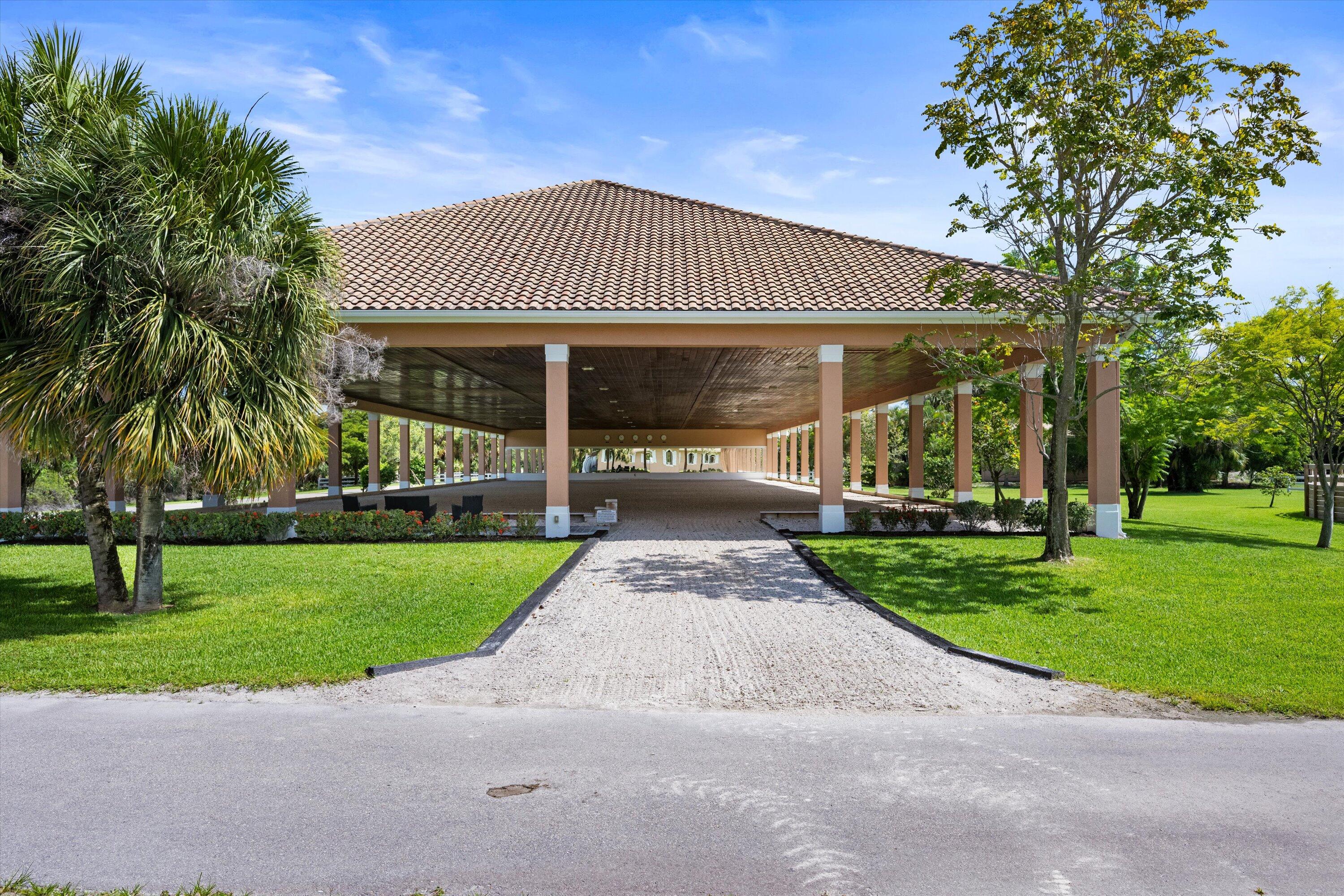 3287 Grande Road Loxahatchee, FL 33470 - Photo 32 of 126 a front view of a house with a yard