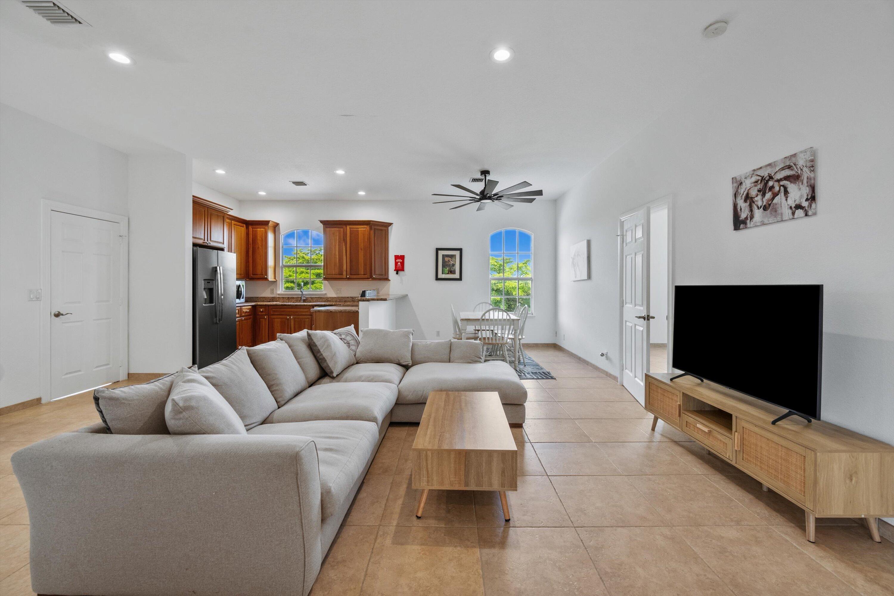 3287 Grande Road Loxahatchee, FL 33470 - Photo 58 of 126 a living room with furniture and a flat screen tv