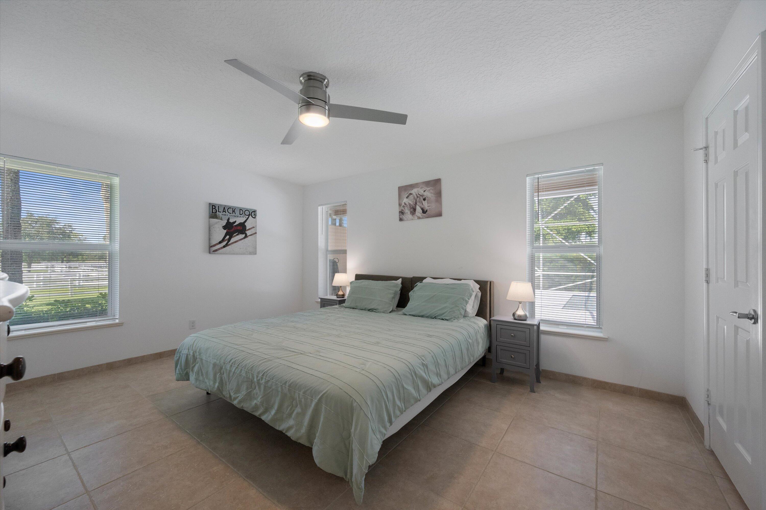 3287 Grande Road Loxahatchee, FL 33470 - Photo 87 of 126 a bedroom with a bed and a window