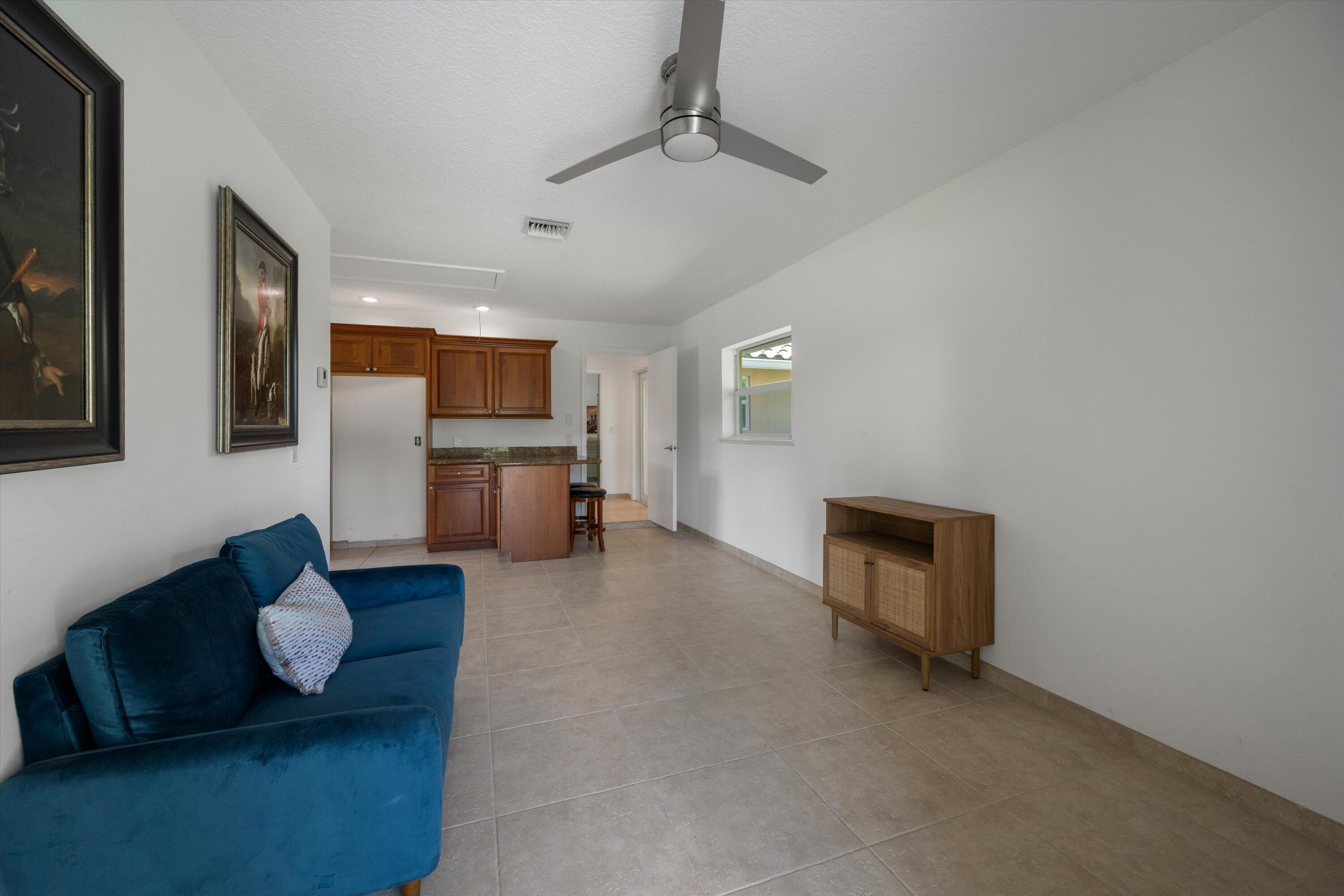 3287 Grande Road Loxahatchee, FL 33470 - Photo 93 of 126 a living room with furniture and a fireplace