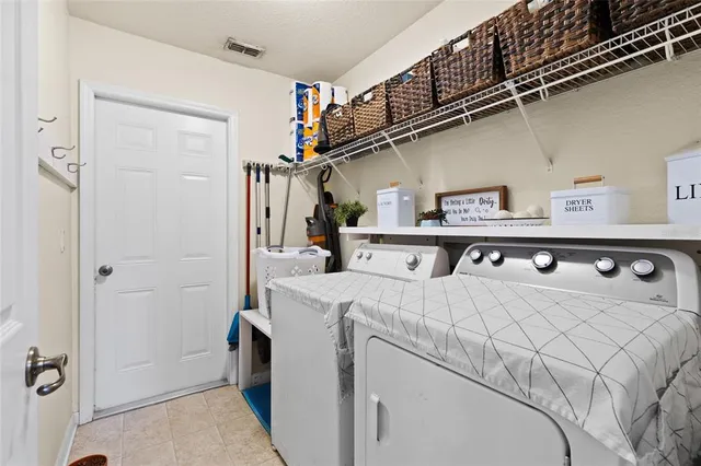 a room with a bed and a dresser