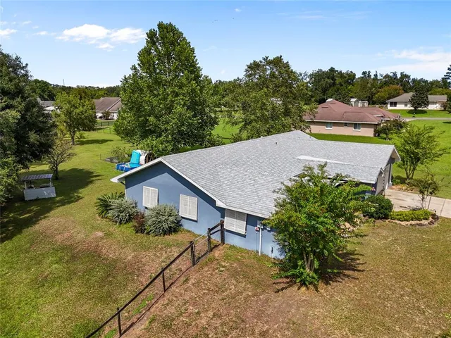 a house with trees in the background