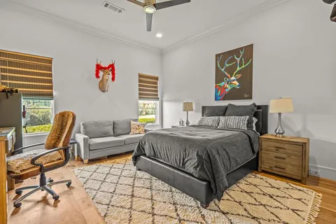 a bedroom with a bed and a couch