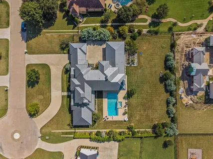 an aerial view of a house with swimming pool