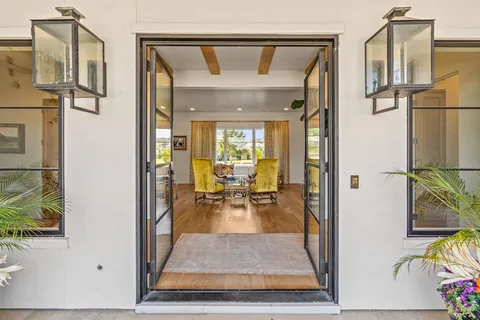 view of living room with furniture and floor to ceiling window