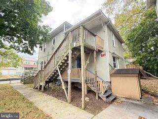 a view of a house with wooden stairs