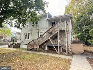 a view of house with a street