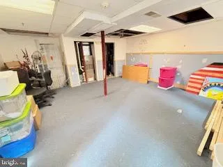 a bedroom with double bunk beds and painted walls