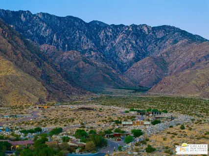 a view of a backyard with wooden fence