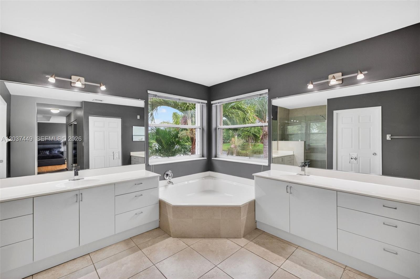 17488 Southwest 28th Court Miramar, FL 33029 - Photo 23 of 50 a large spacious bathroom with a large tub and sink