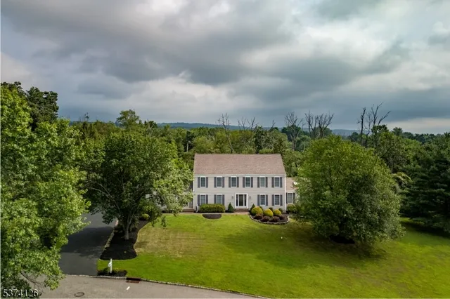aerial view of a house with a yard