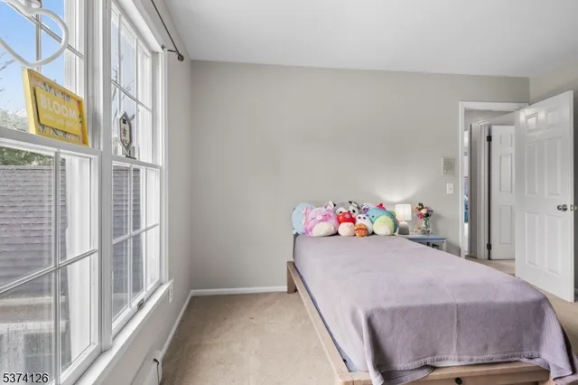 a bed room with a bed and a chair