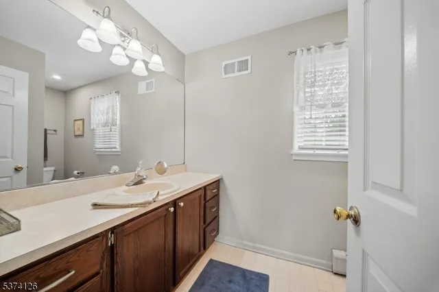 a white toilet sitting next to a shower curtain