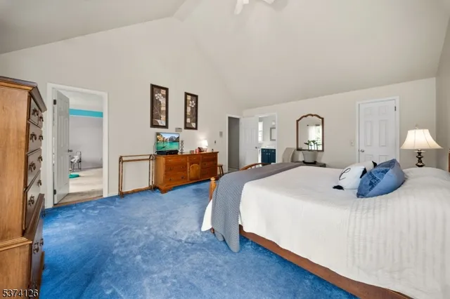 a view of walk in closet with clothes