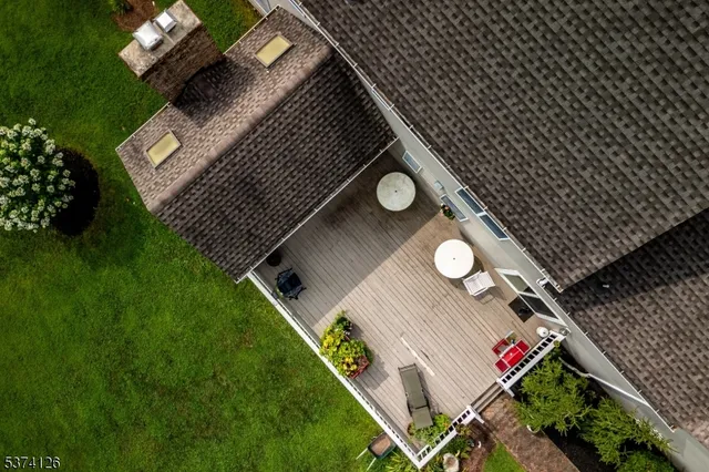 a view of a house with a big yard and potted plants