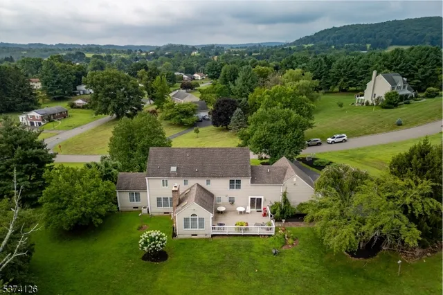 a front view of a house with a garden and yard