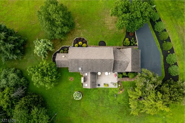 a view of a house with a yard and garage