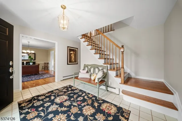 a living room with furniture and a rug