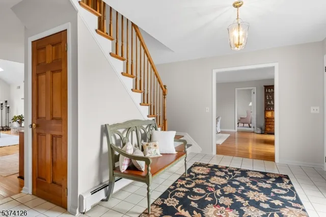 a very nice looking room with wooden floor and a bathroom