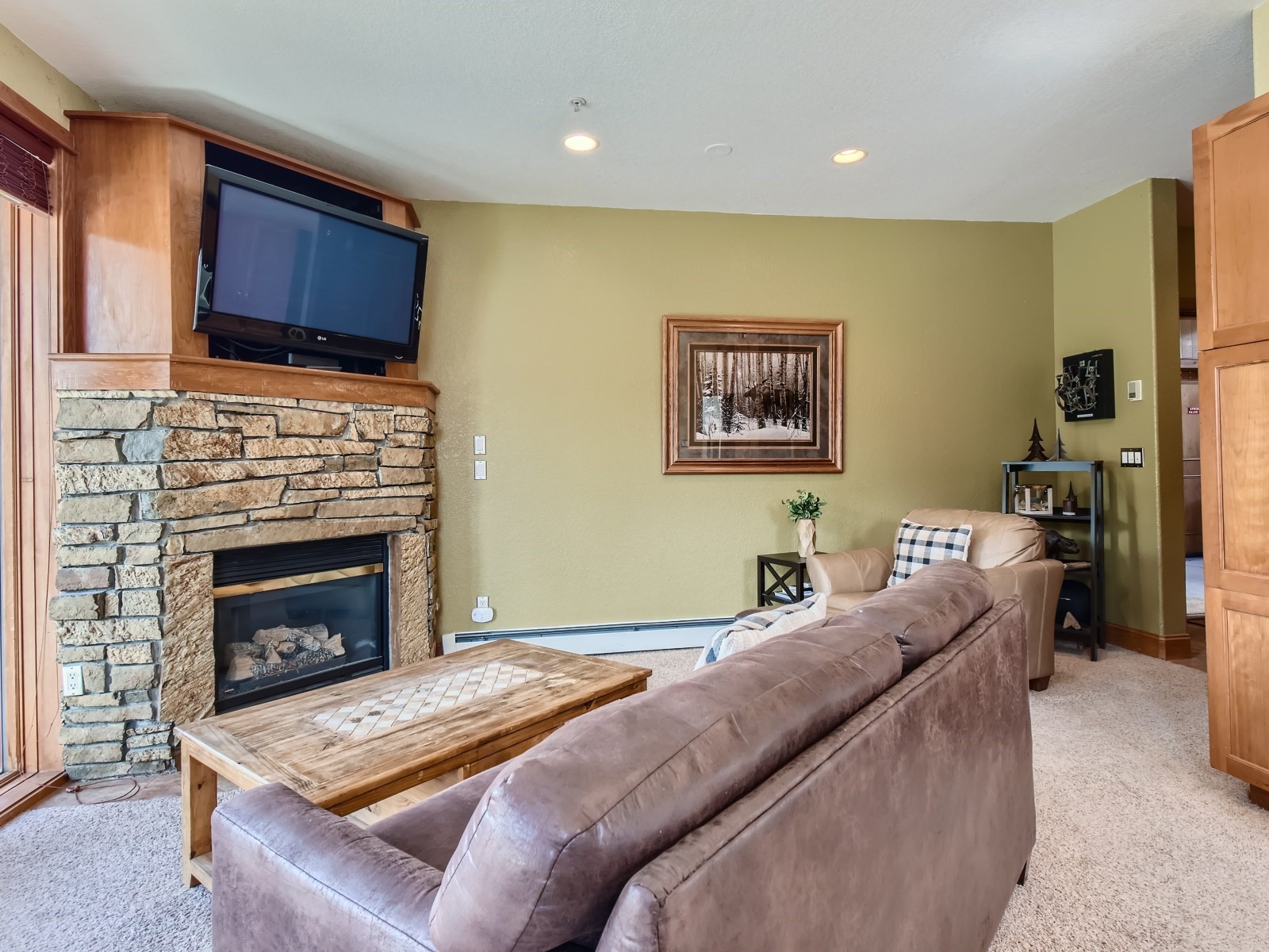63 Antlers Gulch Road, Unit 106 Keystone, CO 80435 - Photo 7 of 28 Cozy Living Room with Gas Fireplace