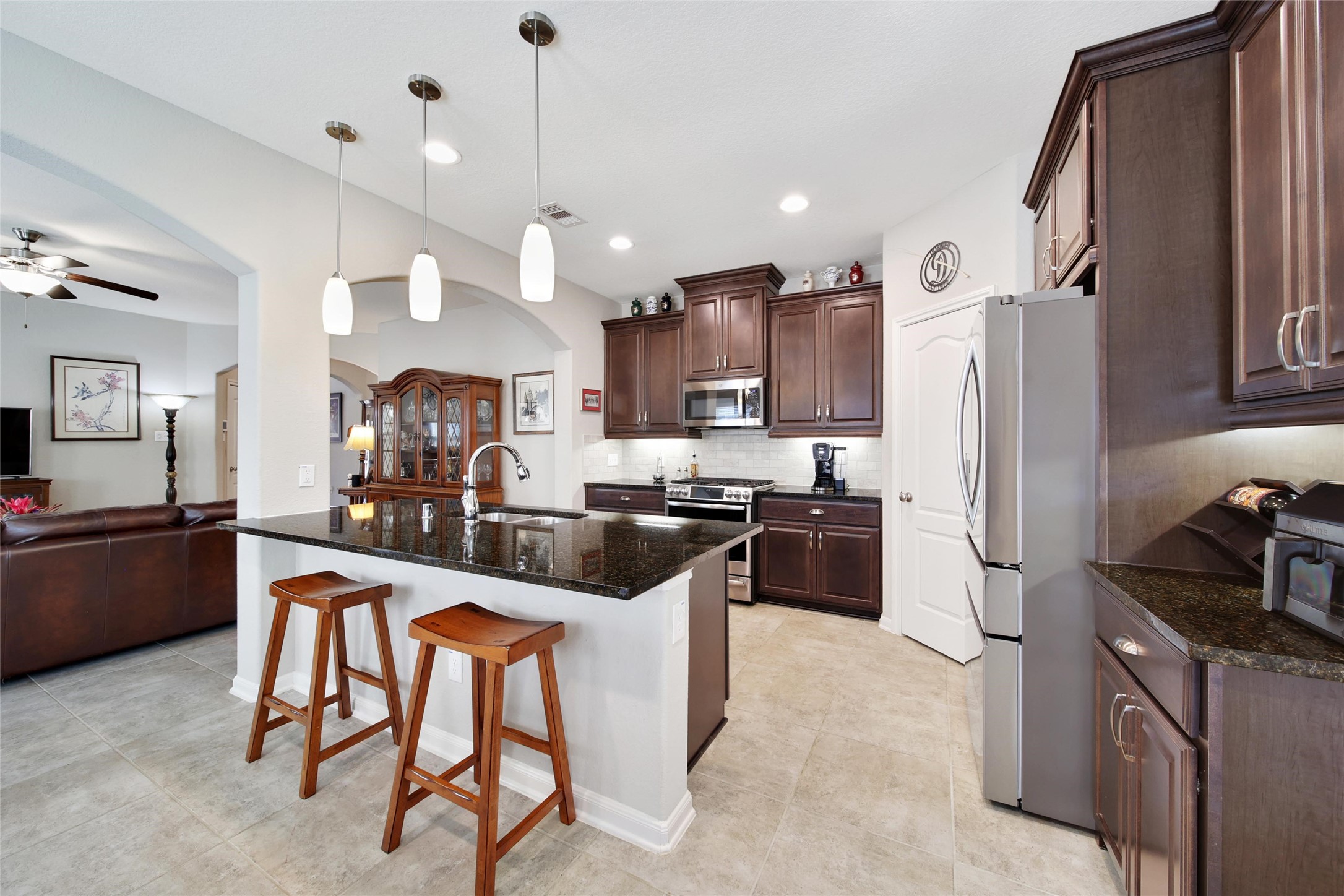 214 Pleasant Hill Way Conroe, TX 77304 - Photo 17 of 43 Friends and family will love to gather around the kitchen island.