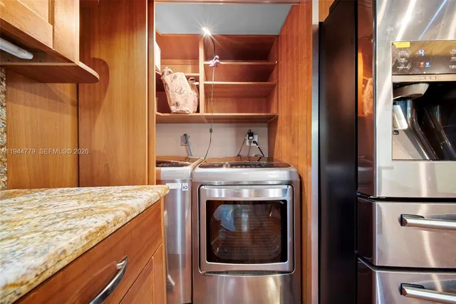 a bathroom with a granite countertop sink a toilet and a mirror