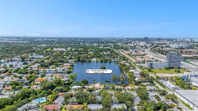 an aerial view of residential building and car parked
