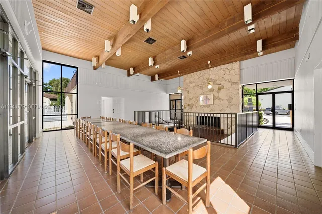 a view of a swimming pool and trees in the background