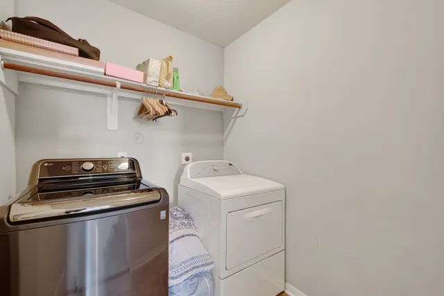 a bed sitting in a room next to a window