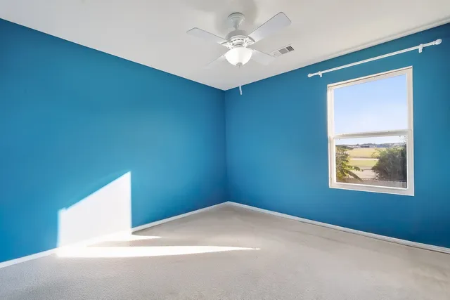 a bathroom with a toilet and shower