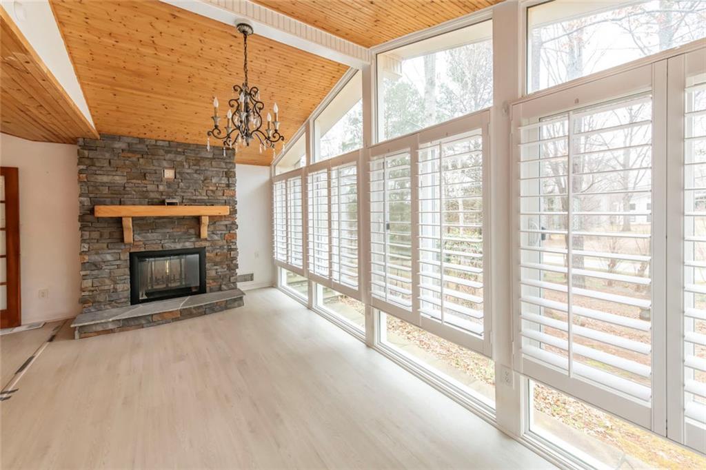 3819 Mason Creek Road Winston, GA 30187 - Photo 12 of 52 a view of an empty room with a fireplace and a window