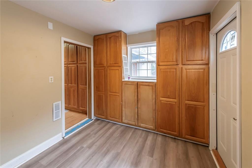 3819 Mason Creek Road Winston, GA 30187 - Photo 22 of 52 an empty room with wooden floor closet and windows