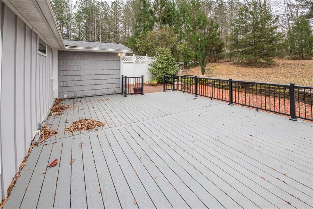 3819 Mason Creek Road Winston, GA 30187 - Photo 28 of 52 a view of backyard with a deck and wooden floor