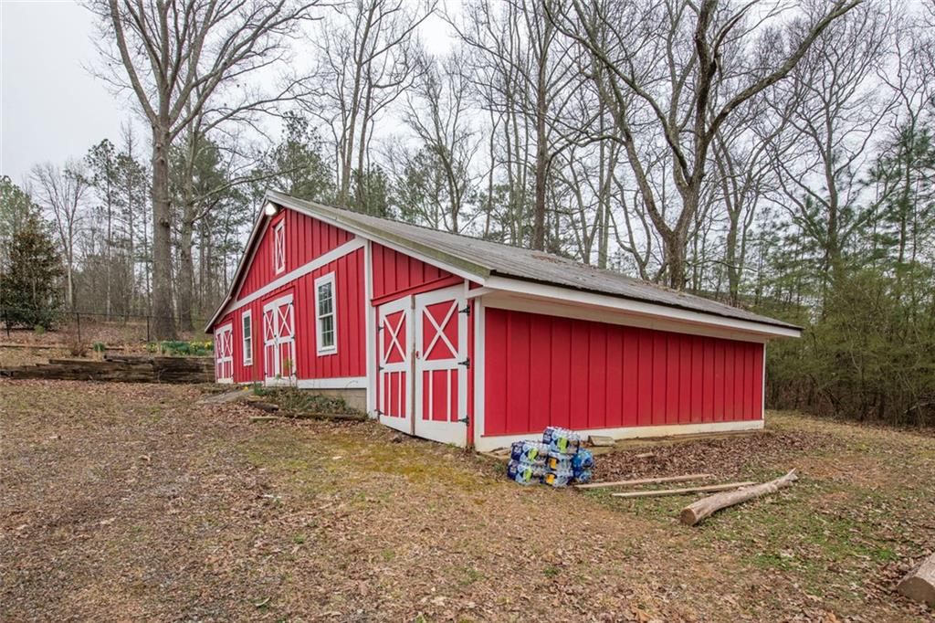 3819 Mason Creek Road Winston, GA 30187 - Photo 29 of 52 a view of a house with a yard and garage