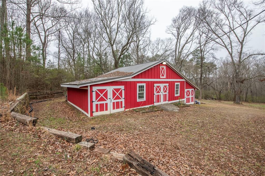3819 Mason Creek Road Winston, GA 30187 - Photo 3 of 52 a view of a house with yard and covered in snow