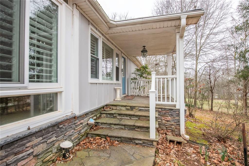 3819 Mason Creek Road Winston, GA 30187 - Photo 41 of 52 a view of a house with a large window