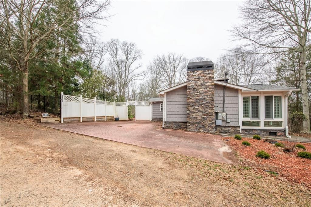 3819 Mason Creek Road Winston, GA 30187 - Photo 42 of 52 a front view of a house with a yard and garage