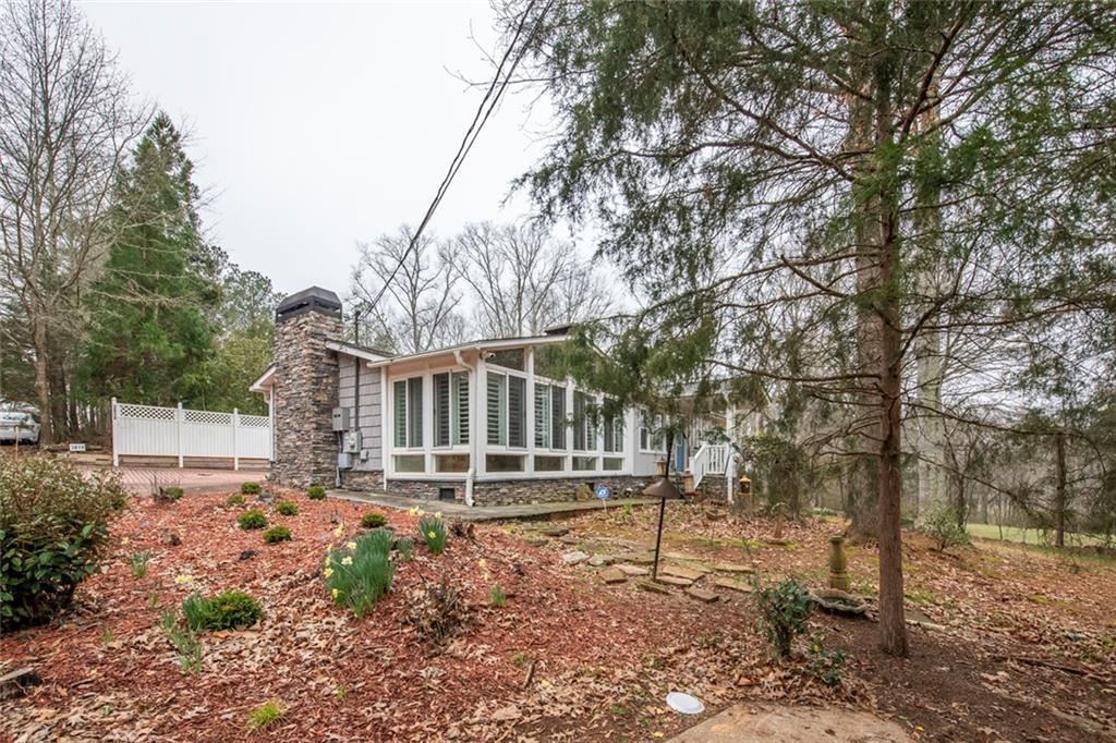 3819 Mason Creek Road Winston, GA 30187 - Photo 50 of 52 a front view of a house with a garden
