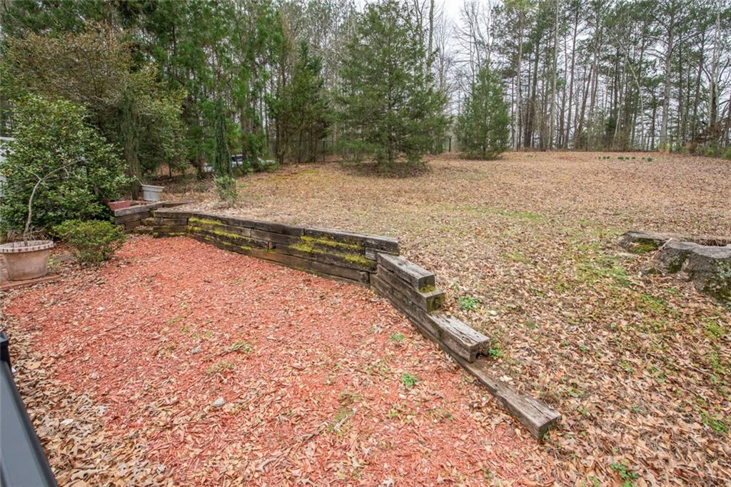 3819 Mason Creek Road Winston, GA 30187 - Photo 51 of 52 a view of a yard with trees