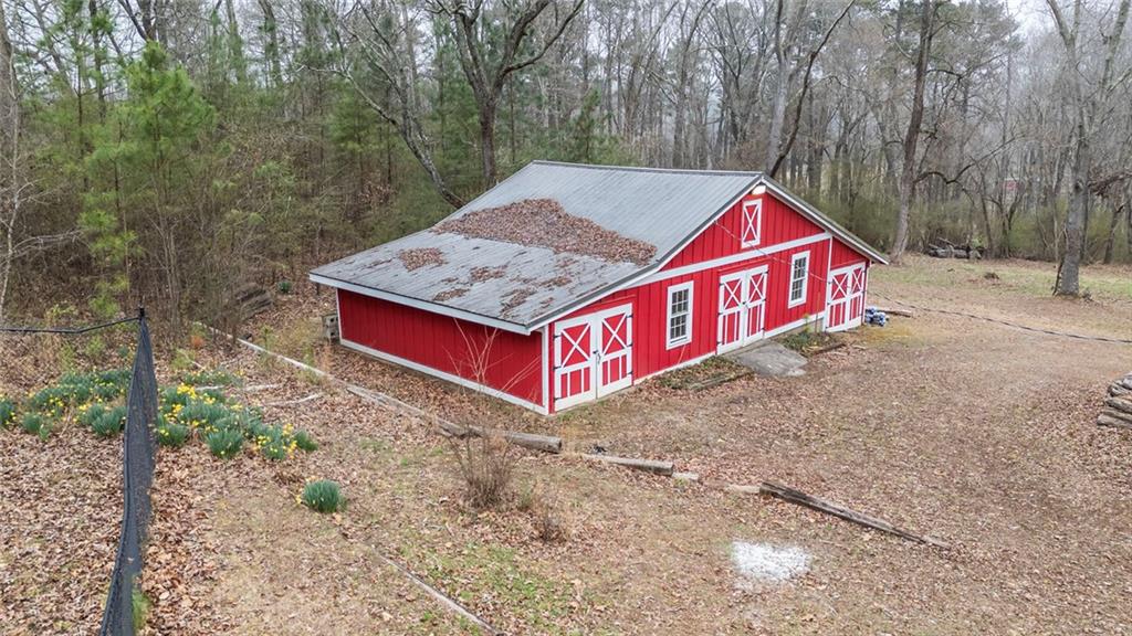 3819 Mason Creek Road Winston, GA 30187 - Photo 8 of 52 a view of a wooden house with large trees