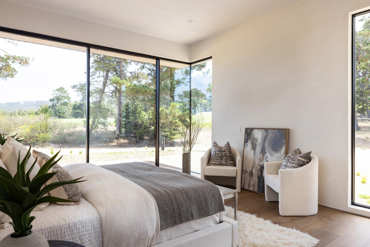 31 Poppy Lane Pebble Beach, CA 93953 - Photo 27 of 45 a bedroom with a large bed and a large window with outer view