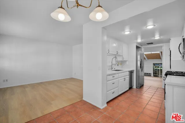 a view of a kitchen with wooden floor