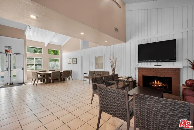 an outdoor space with swimming pool and furniture