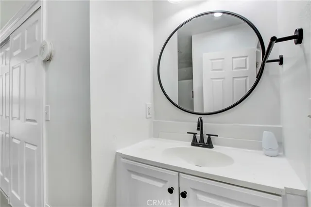a bathroom with a sink and mirror