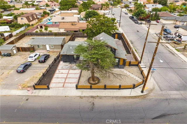 an aerial view of residential houses with outdoor space