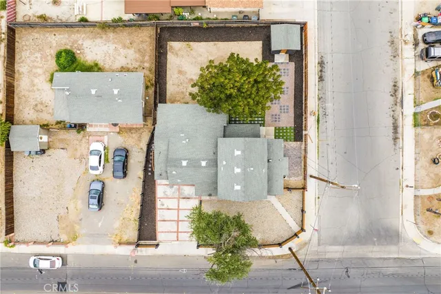 an aerial view of a house with a swimming pool